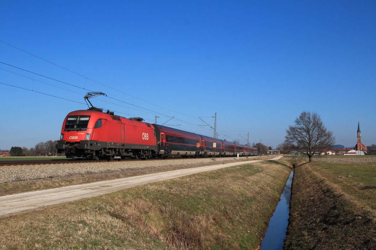 1116 268-8 mit einem  Railjet  am 28. Februar 2014 bei �bersee.